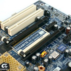 A Gigabyte GA-K8NXP-SLI motherboard with a SLI switch card